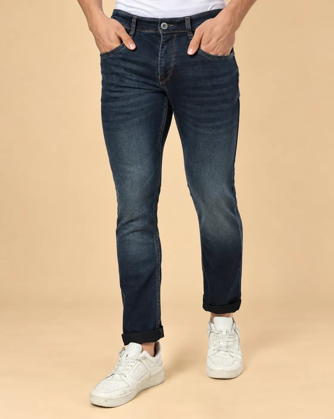 Dark blue green mid wash jeans